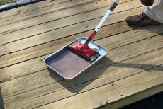 using a paint tray for the deck restoration sealer